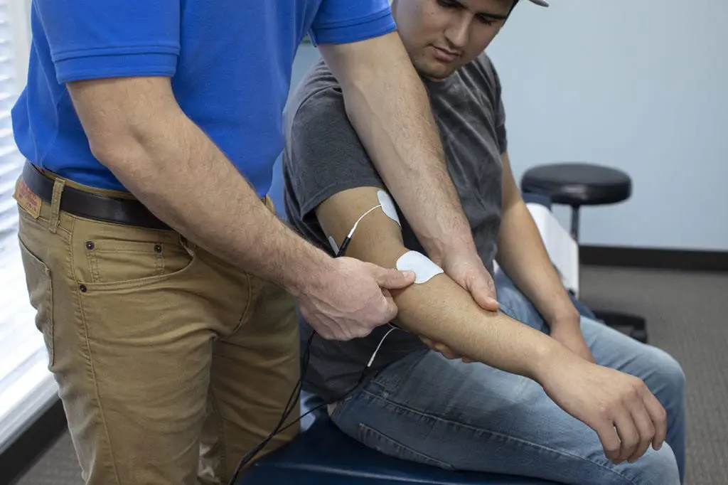 How electric muscle stimulation (EMS) is used for rehabilitation of low back  pain