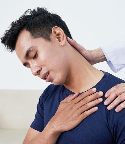 A Chiropractor adjusting a patients neck.