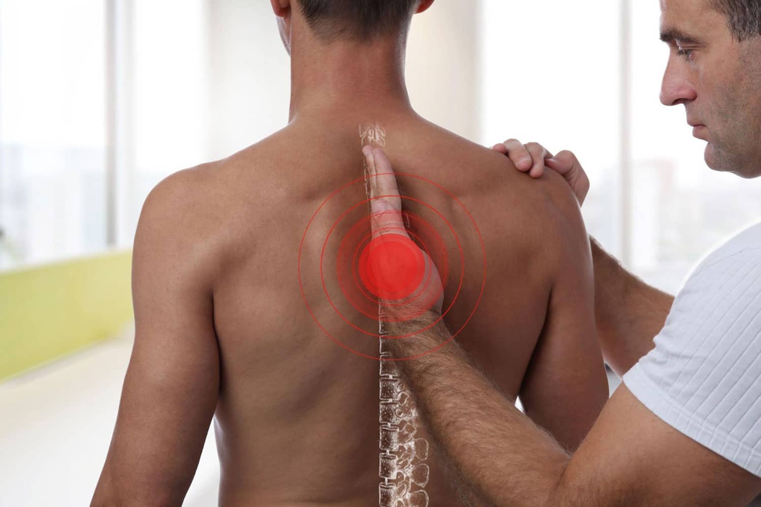A man getting a chiropractic adjustment for back pain.