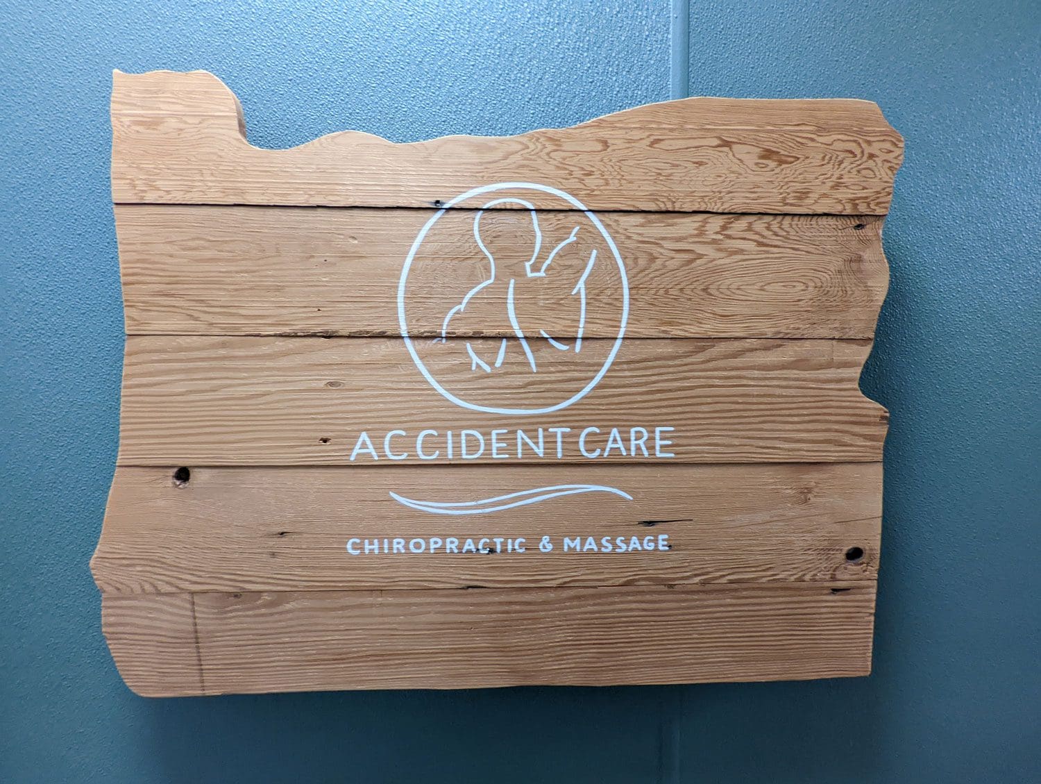 Accident Care Chiropractic & Massage wooden sign.