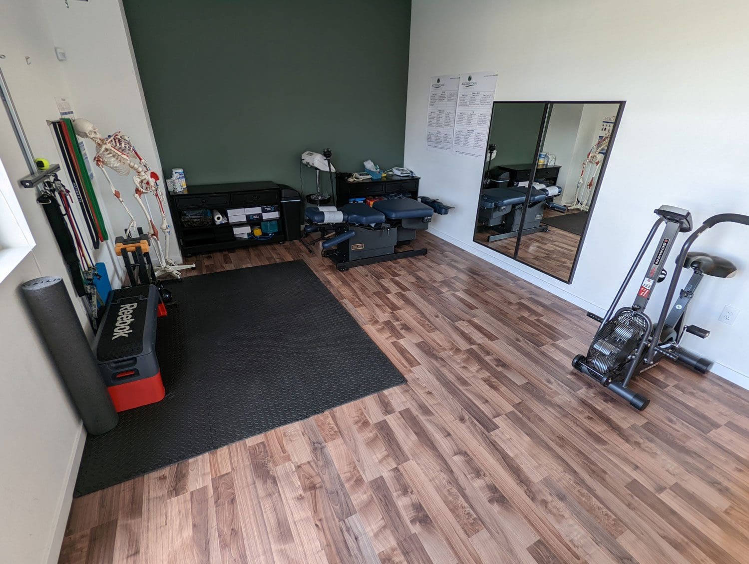 Tigard Chiropractor physical therapy room with exercise and rehabilitation equipment.