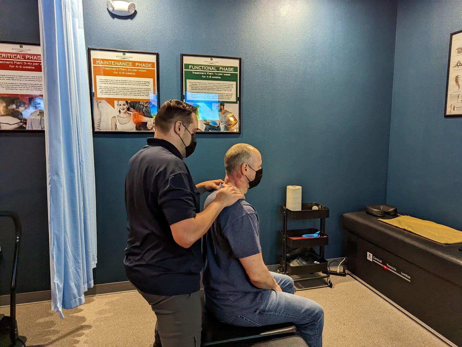 A chiropractor administering an adjustment for a patient at the Vancouver Chiropractic clinic.