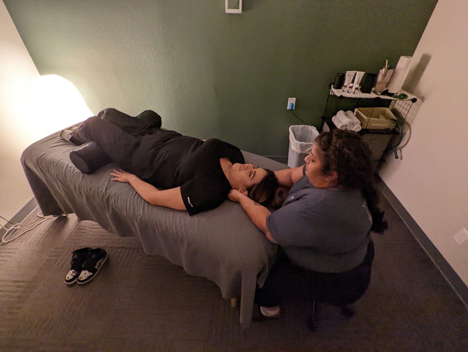 a woman getting a massage at Woodburn Chiropractic.