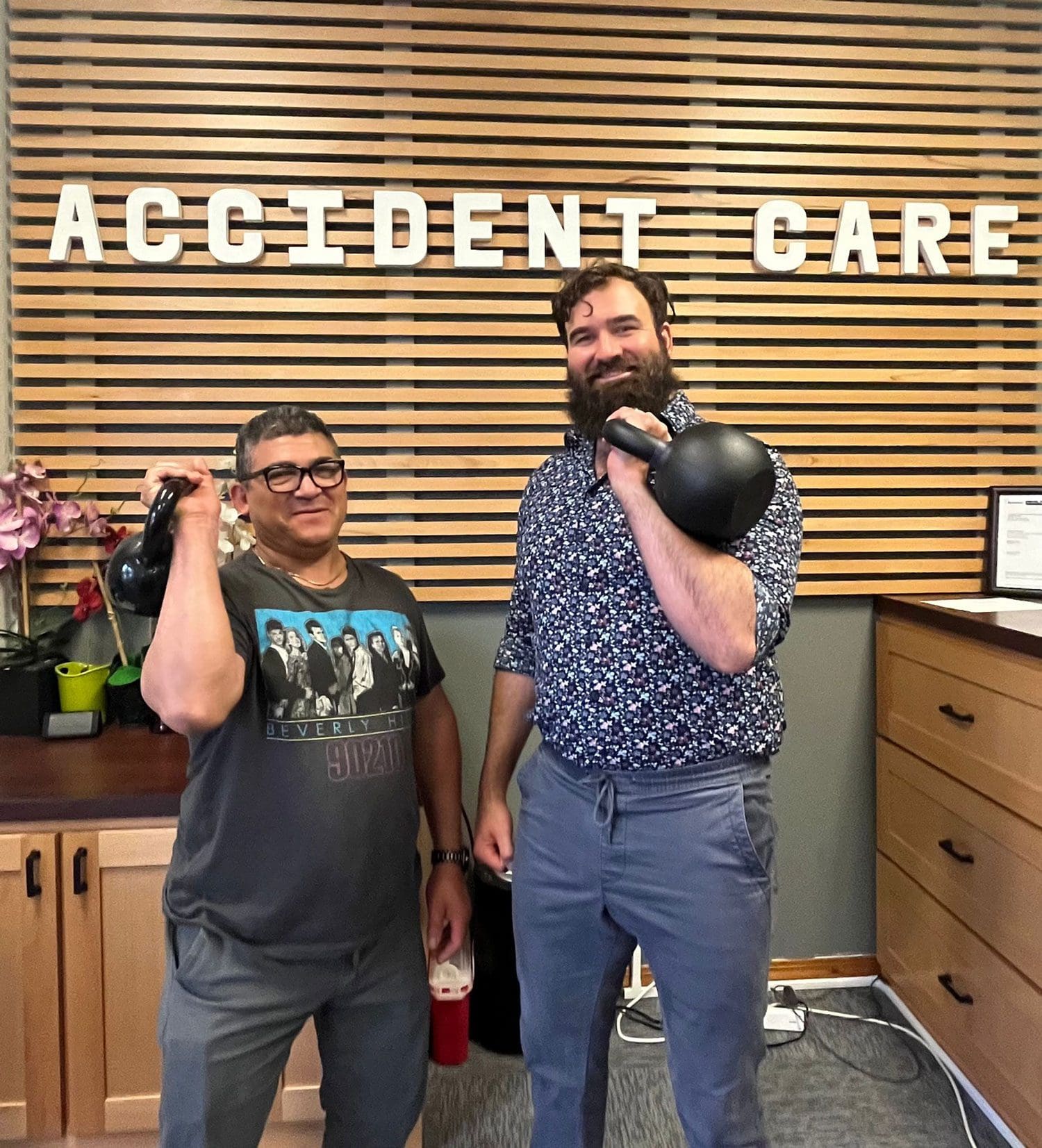 Two men participage in physical therapy at Accident Care Chiropractic