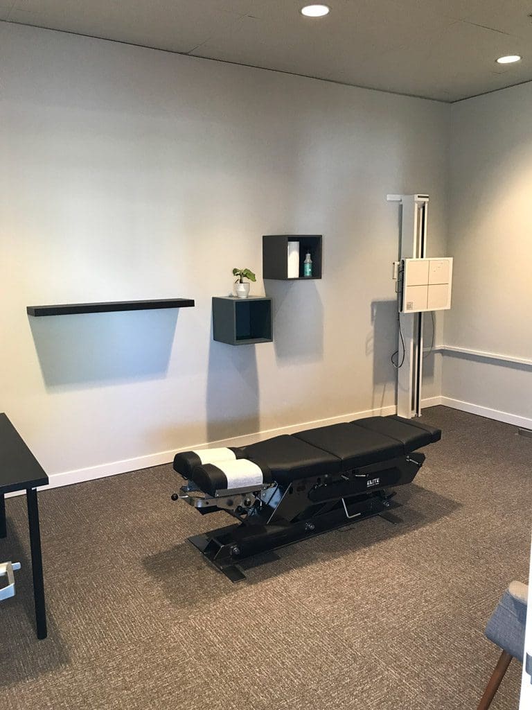 Bend Clinic x-ray room with chiropractic table and x-ray machine