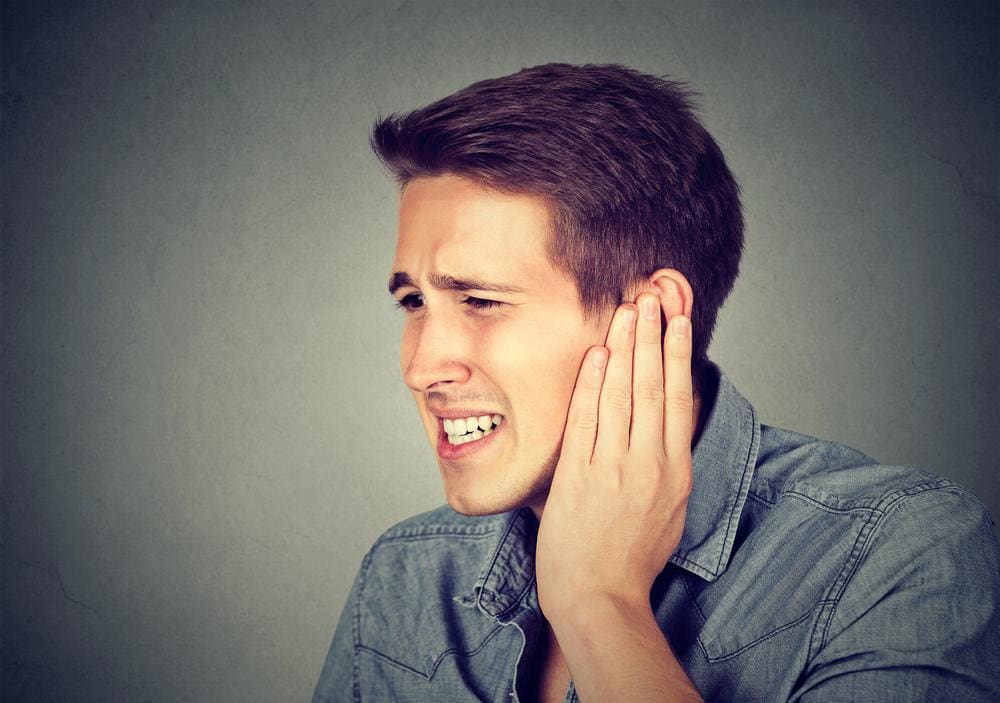 A man is suffering from chronic tinnitus.