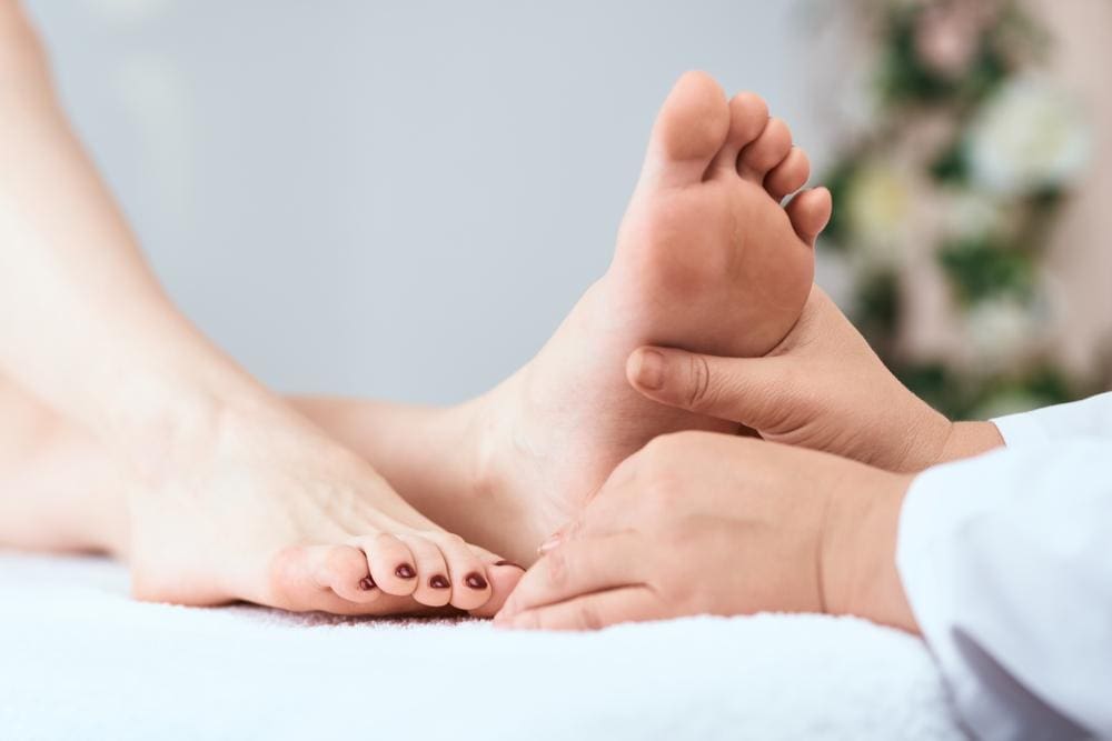 A chiropractor is treating a patient for heel pain. 
