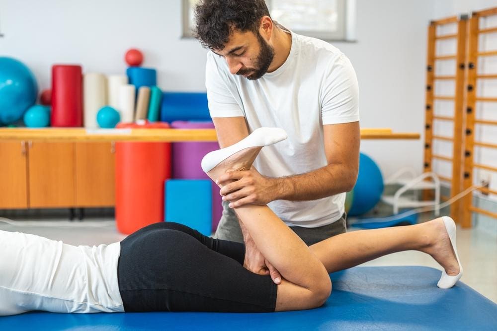 A chiropractor is treating a patient for sciatica. 