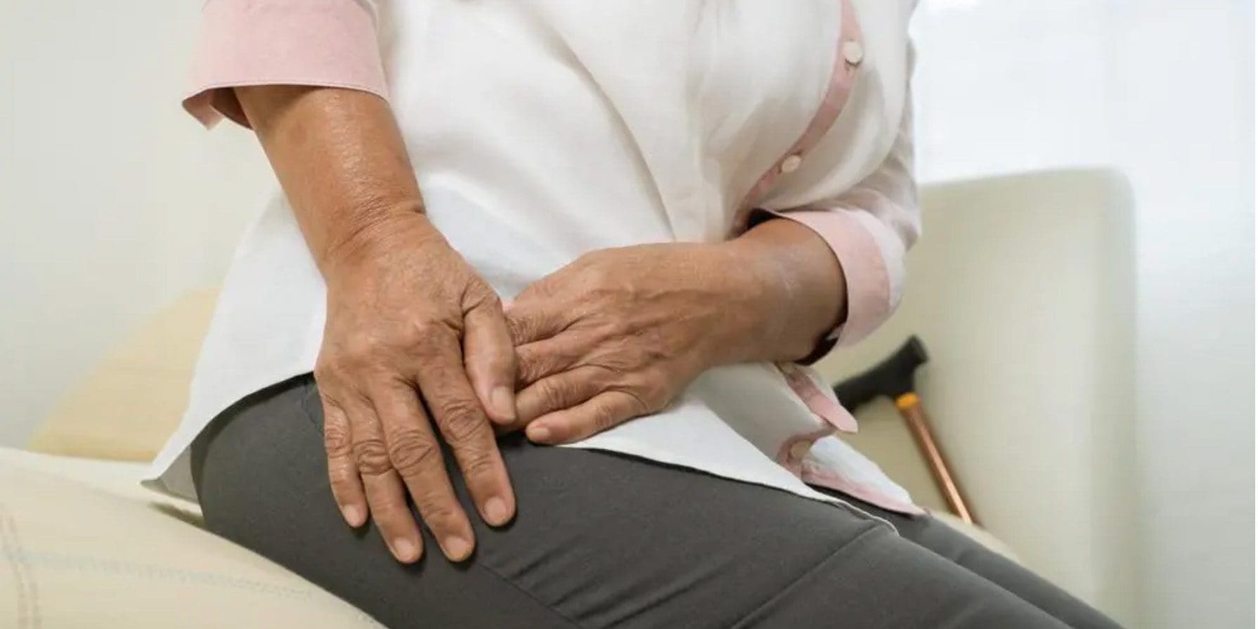 A woman is suffering from hip bursitis and is having mobility issues.